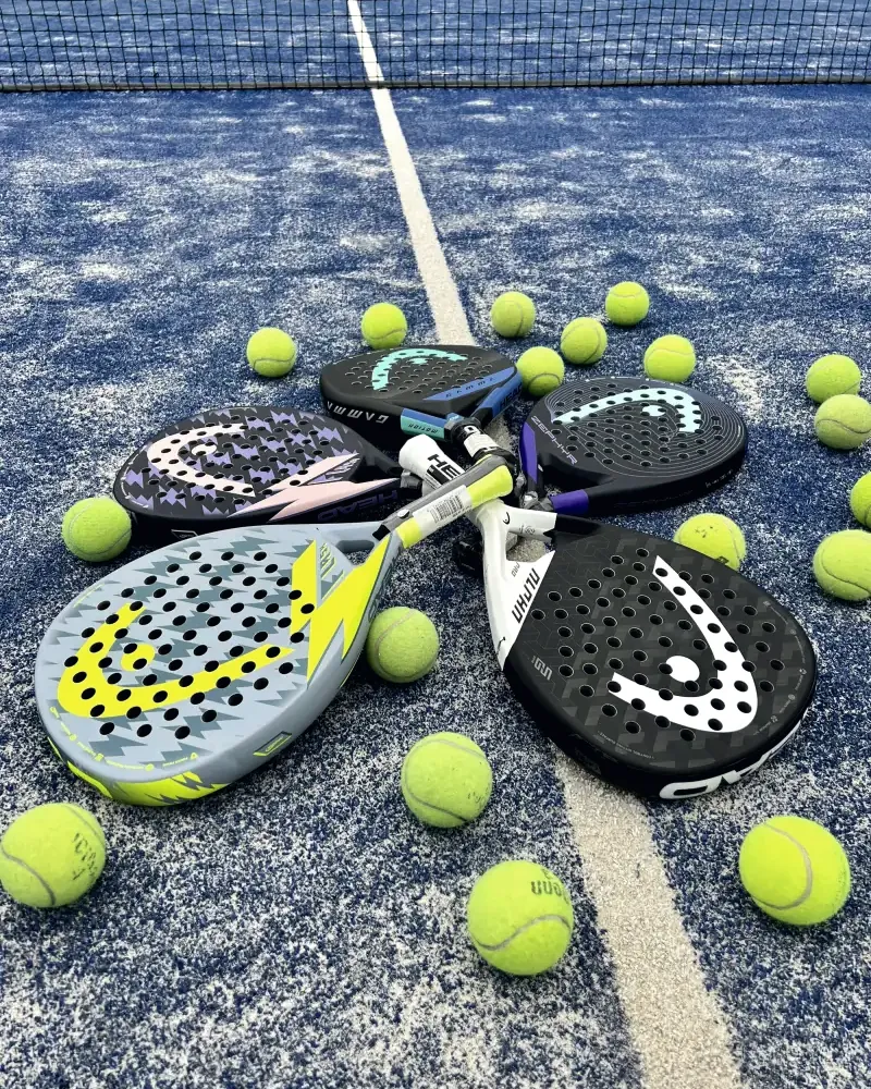 Padel rackets and balls on the court